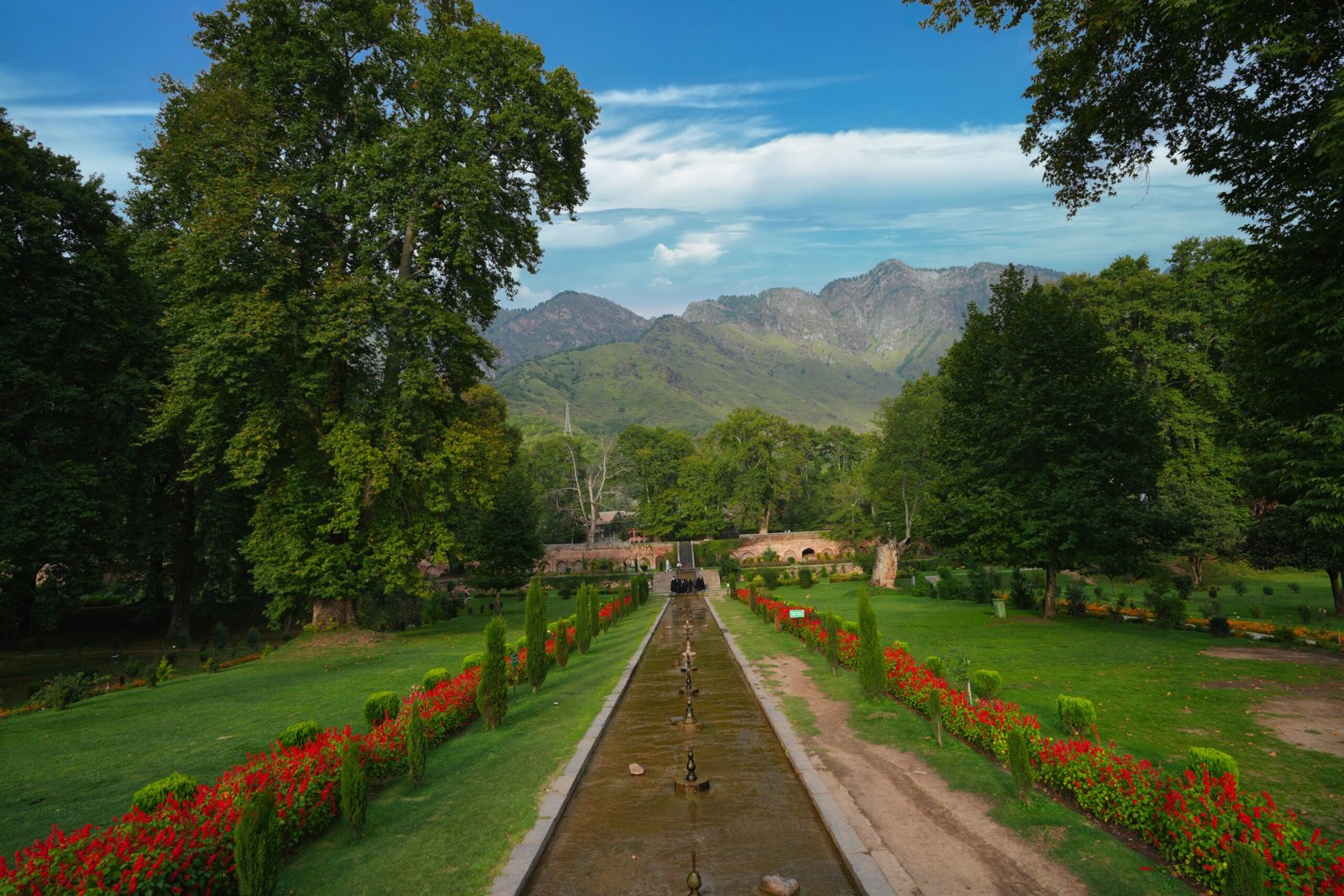 Shalimar Bagh Mughal Garden in Srinagar with terraced water channels, Chinar trees and Himalayan views.