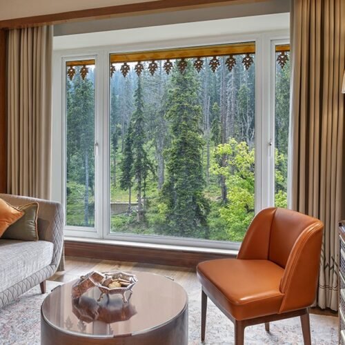 Premier Room at The Khyber Himalayan Resort & Spa in Gulmarg with forest views and luxury interiors.